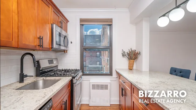a kitchen with a sink cabinets and a granite counter tops
