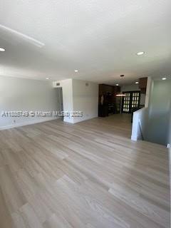241 Wimbledon Lakes Drive, Unit 241 Plantation, FL 33324 - Photo 16 of 16 an empty room with wooden floor and windows