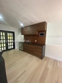 a spacious bedroom with a bed and a window