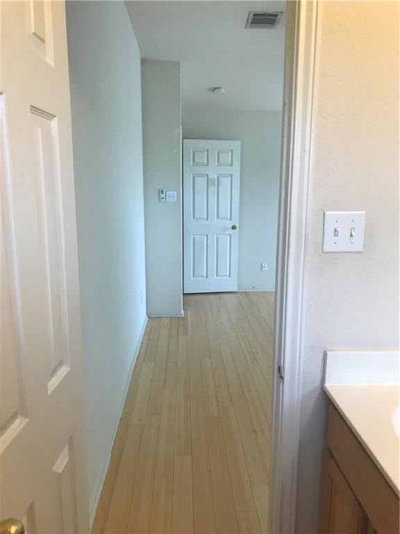 8337 Alvin High Lane Austin, TX 78729 - Photo 14 of 14 Hall with light wood-style floors