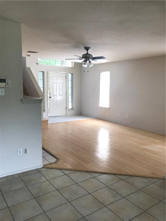 8337 Alvin High Lane Austin, TX 78729 - Photo 6 of 14 Entrance foyer with light tile patterned flooring and ceiling fan