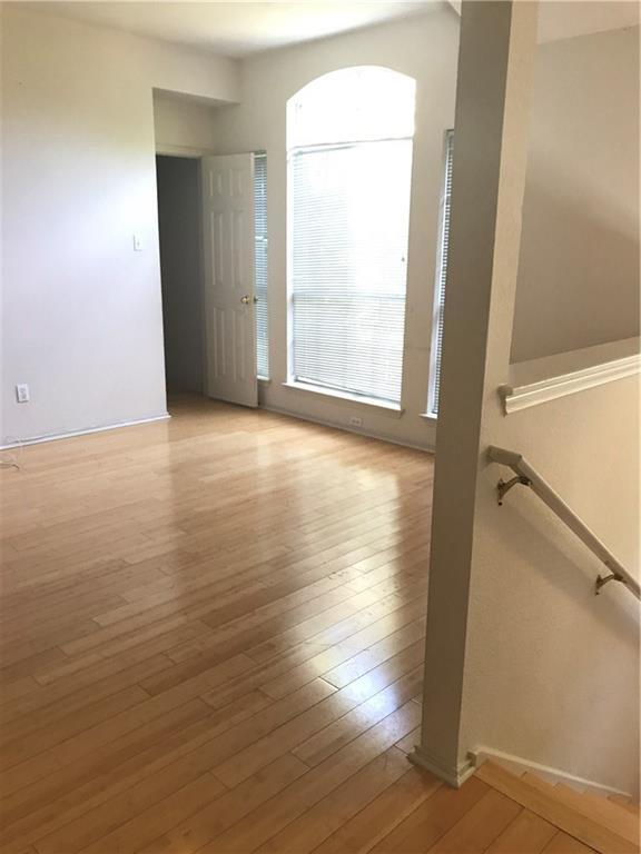 8337 Alvin High Lane Austin, TX 78729 - Photo 8 of 14 Empty room featuring light wood finished floors