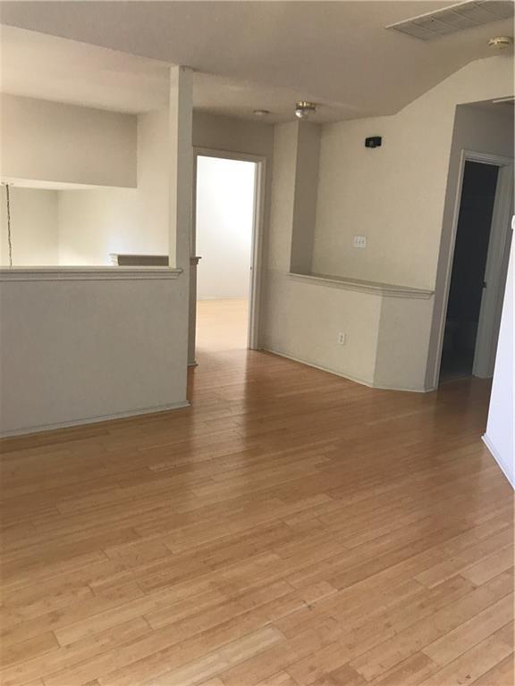 8337 Alvin High Lane Austin, TX 78729 - Photo 9 of 14 Empty room with light wood-style flooring