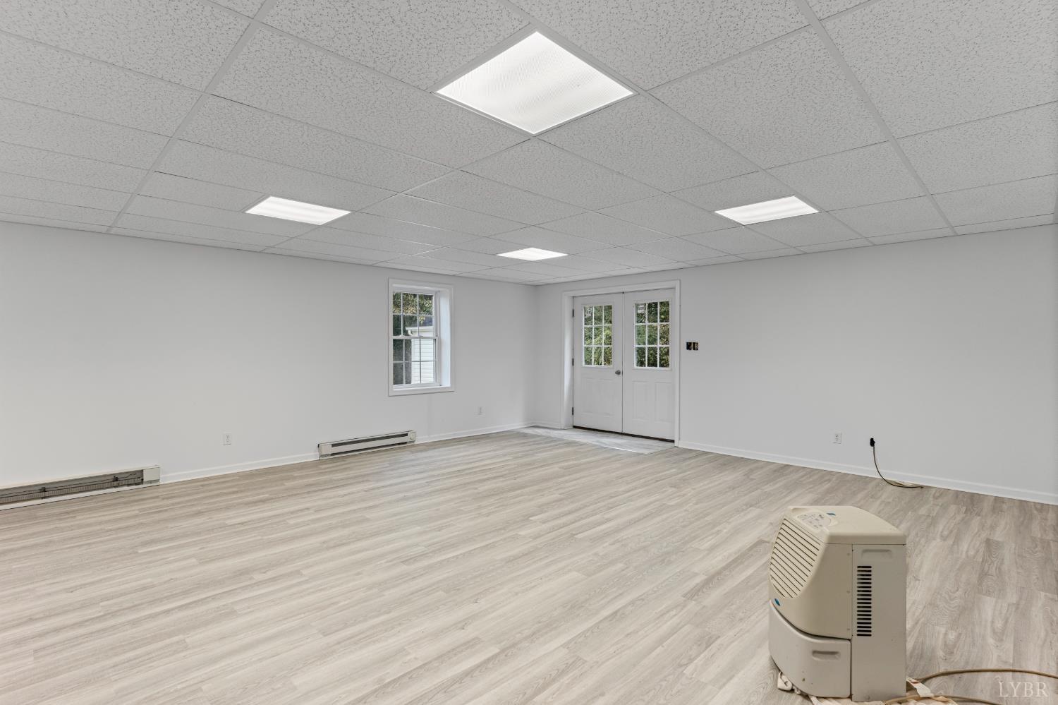 233 View Lane Concord, VA 24538 - Photo 24 of 45 an empty room with wooden floor and windows