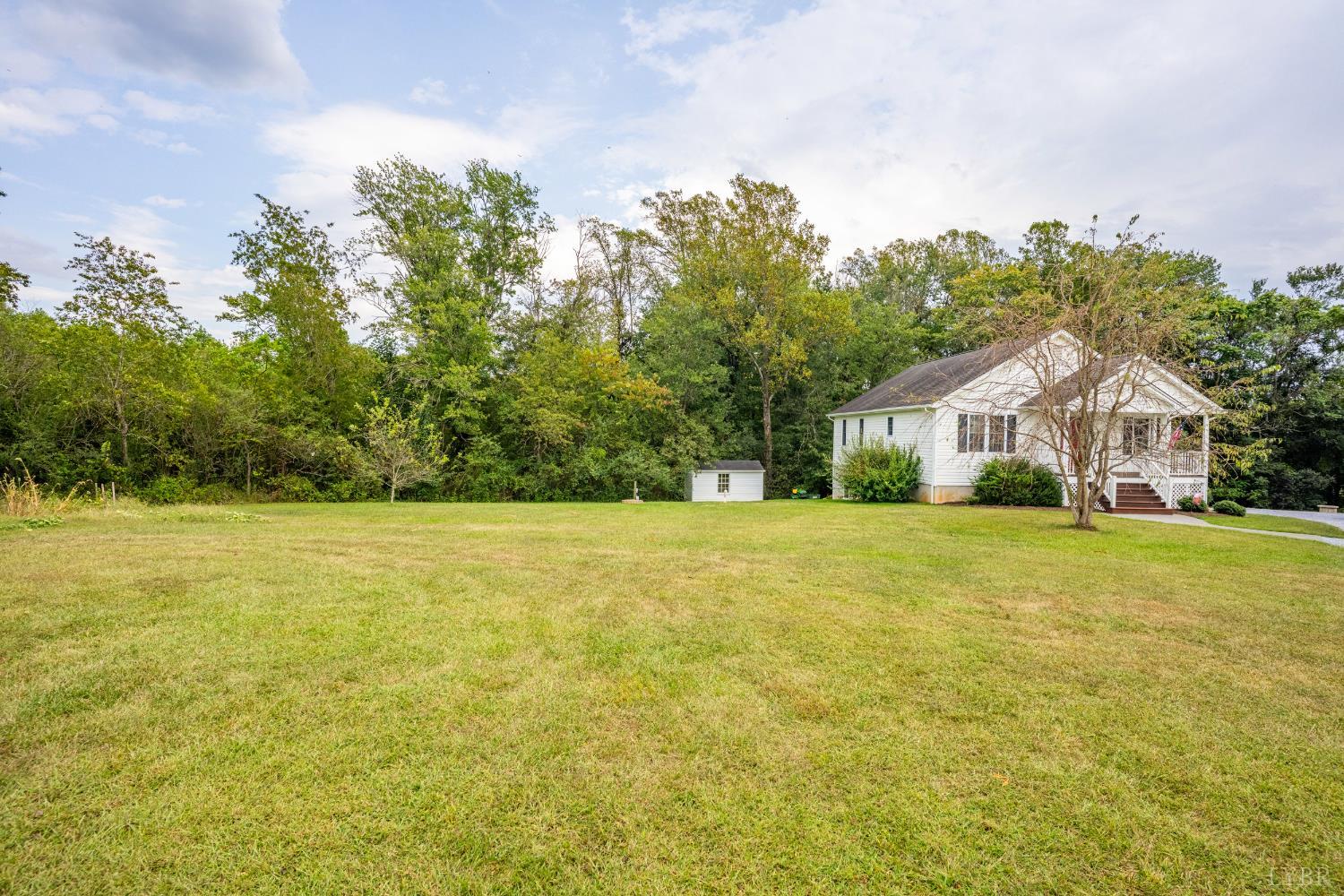 233 View Lane Concord, VA 24538 - Photo 33 of 45 a front view of house with yard and trees in the background