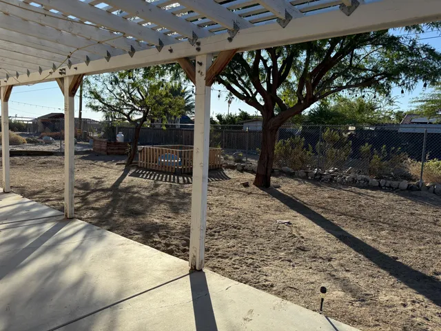 a view of a house with backyard