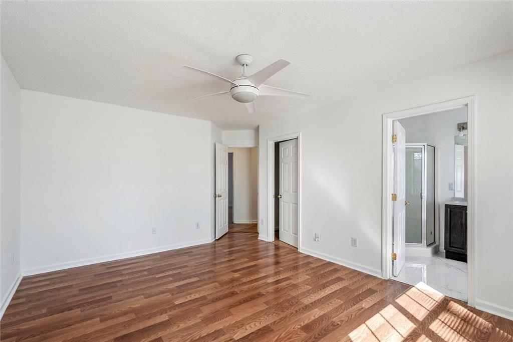6132 Christopher Terrace Rex, GA 30273 - Photo 17 of 40 a view of a livingroom with wooden floor and a ceiling fan