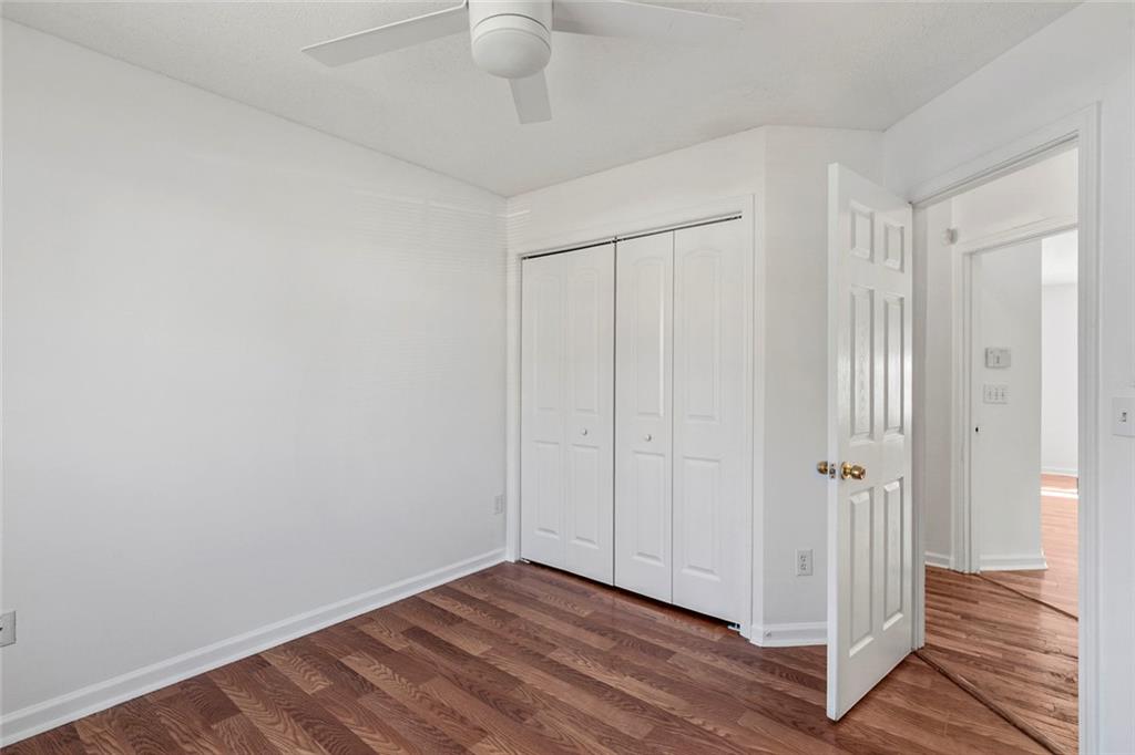 6132 Christopher Terrace Rex, GA 30273 - Photo 20 of 40 a view of an empty room with wooden floor