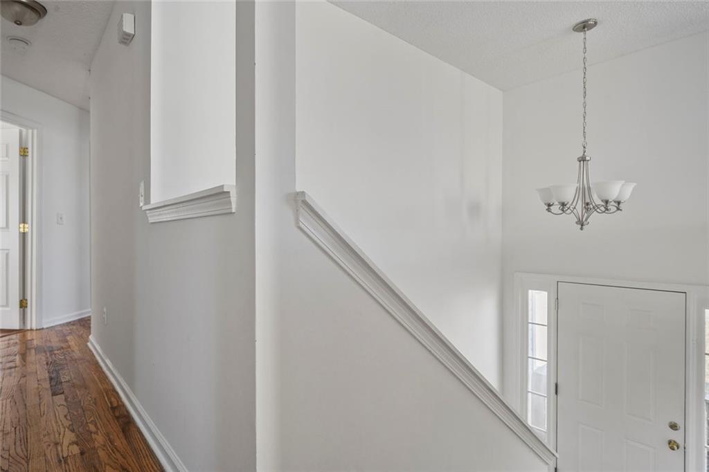6132 Christopher Terrace Rex, GA 30273 - Photo 24 of 40 a view of a hallway with wooden floor