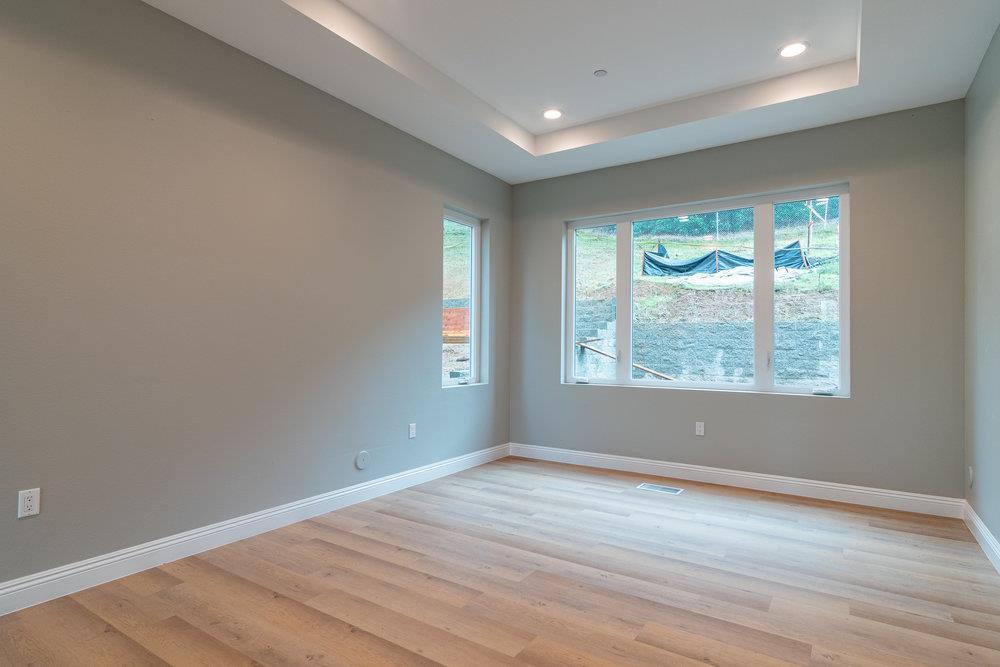 6565 Eagle Ridge Court Gilroy, CA 95020 - Photo 11 of 57 an empty room with wooden floor and windows