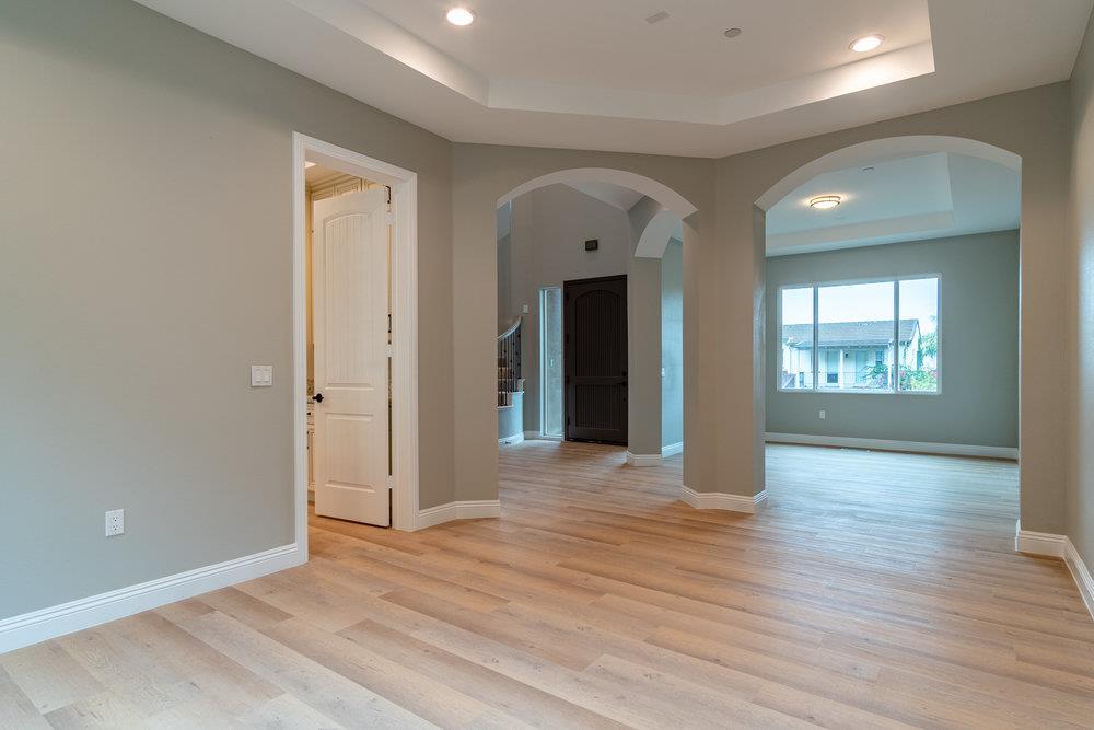 6565 Eagle Ridge Court Gilroy, CA 95020 - Photo 12 of 57 an empty room with wooden floor and windows