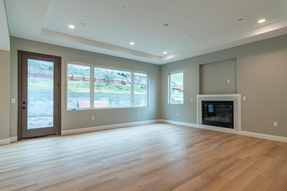6565 Eagle Ridge Court Gilroy, CA 95020 - Photo 13 of 57 a view of an empty room with wooden floor and a window