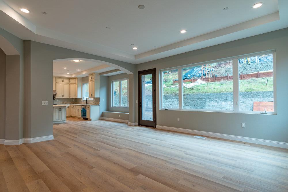 6565 Eagle Ridge Court Gilroy, CA 95020 - Photo 14 of 57 a view of an empty room with wooden floor and a window