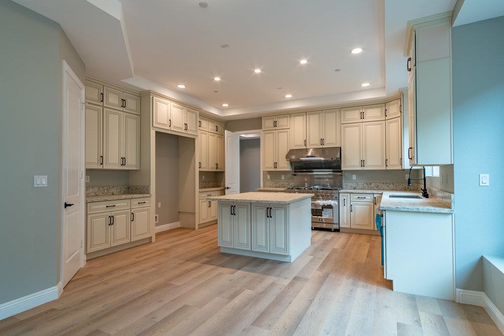6565 Eagle Ridge Court Gilroy, CA 95020 - Photo 18 of 57 a kitchen with a refrigerator stove top oven and sink