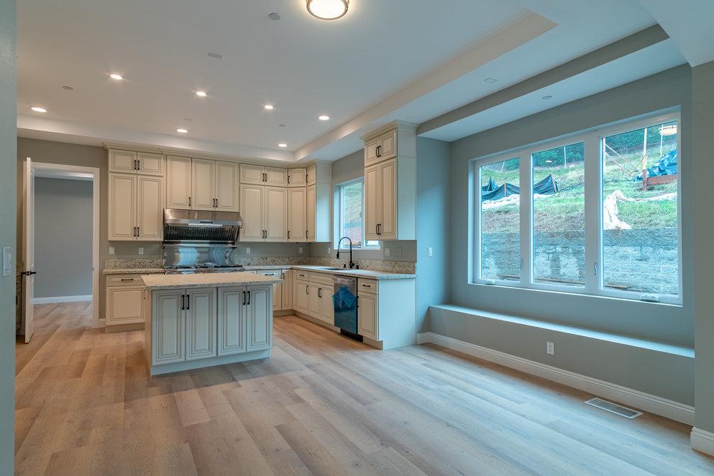 6565 Eagle Ridge Court Gilroy, CA 95020 - Photo 19 of 57 a kitchen with stainless steel appliances granite countertop a stove a sink and a refrigerator