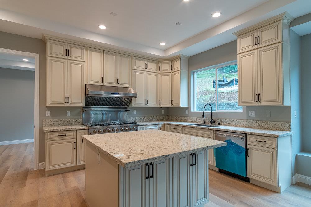 6565 Eagle Ridge Court Gilroy, CA 95020 - Photo 21 of 57 a kitchen with a sink stove and cabinets