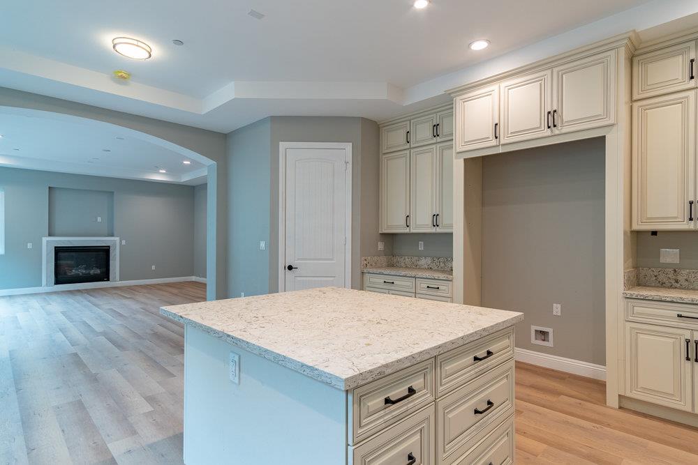 6565 Eagle Ridge Court Gilroy, CA 95020 - Photo 23 of 57 a kitchen with a stove and a refrigerator