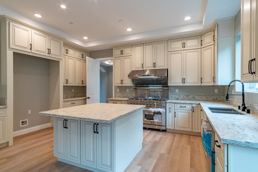 6565 Eagle Ridge Court Gilroy, CA 95020 - Photo 24 of 57 a kitchen with stainless steel appliances granite countertop a sink stove and refrigerator