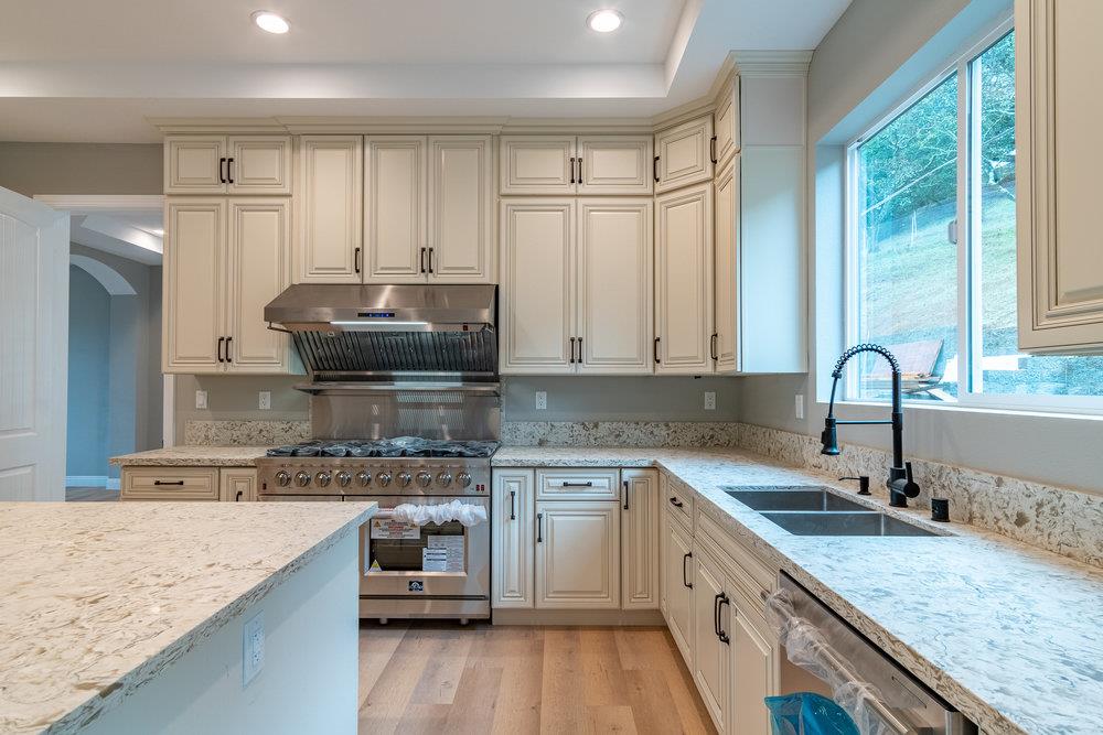 6565 Eagle Ridge Court Gilroy, CA 95020 - Photo 25 of 57 a kitchen with a sink stove and cabinets