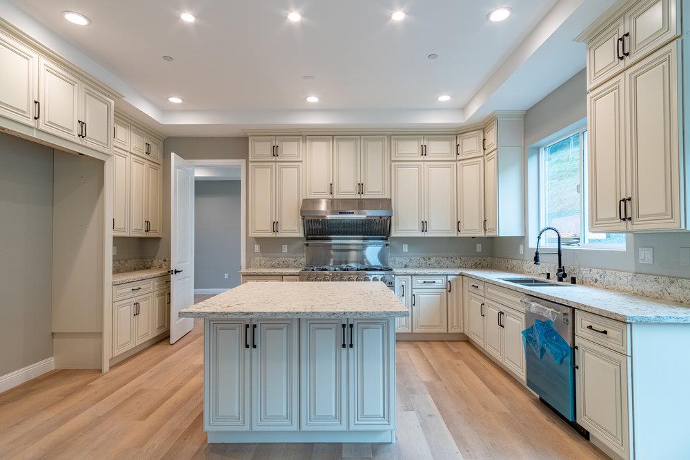 6565 Eagle Ridge Court Gilroy, CA 95020 - Photo 26 of 57 a large kitchen with stainless steel appliances granite countertop a sink and cabinets