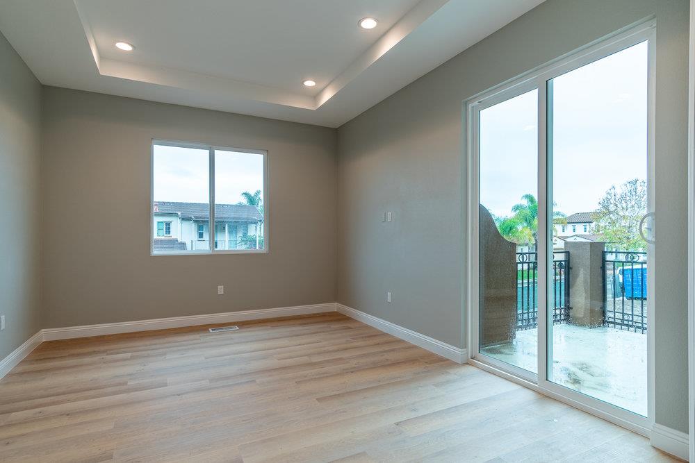 6565 Eagle Ridge Court Gilroy, CA 95020 - Photo 27 of 57 an empty room with wooden floor and windows