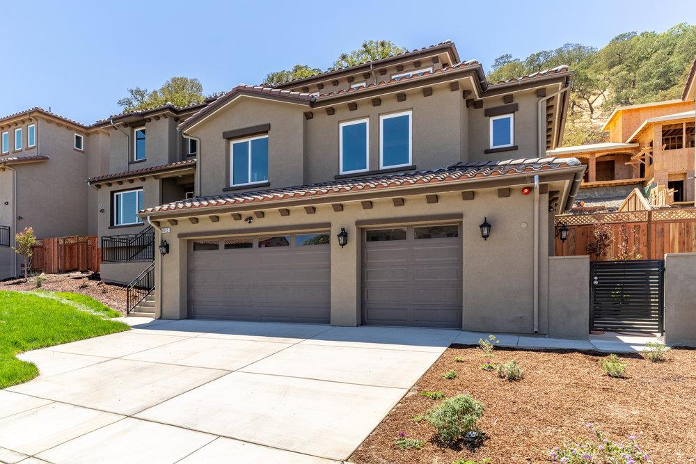 6565 Eagle Ridge Court Gilroy, CA 95020 - Photo 3 of 57 a front view of a house with a yard