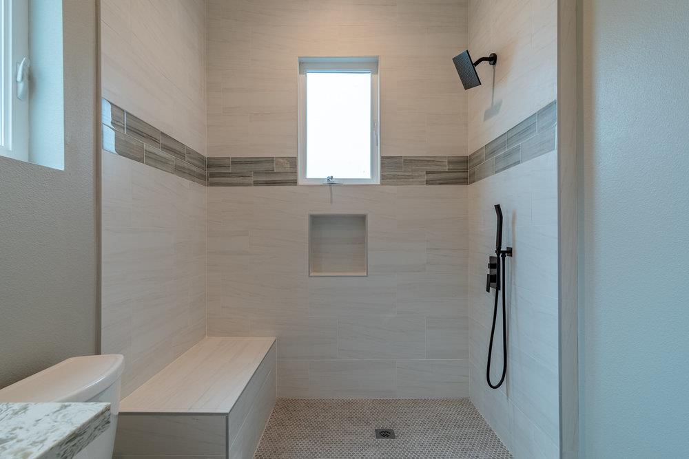 6565 Eagle Ridge Court Gilroy, CA 95020 - Photo 33 of 57 a bathroom with a granite countertop shower and a sink