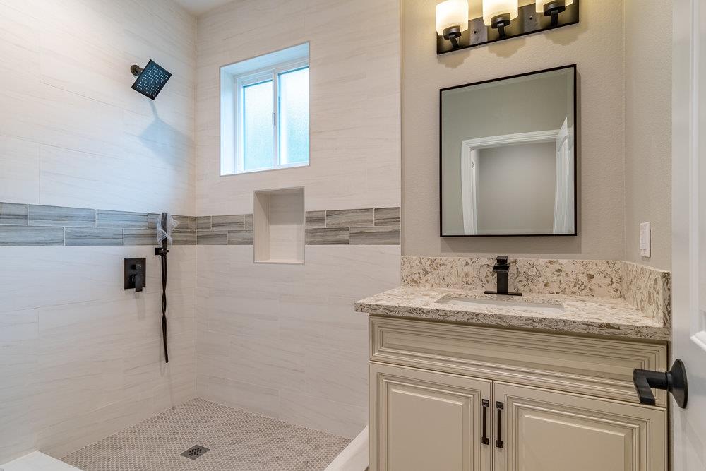 6565 Eagle Ridge Court Gilroy, CA 95020 - Photo 51 of 57 a bathroom with a sink and a mirror