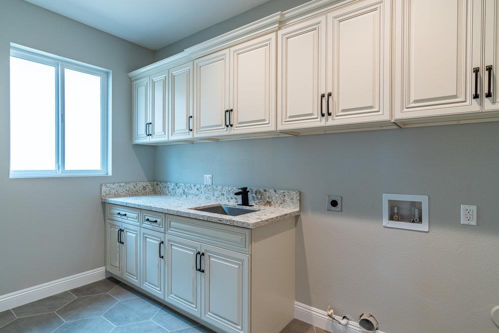 6565 Eagle Ridge Court Gilroy, CA 95020 - Photo 57 of 57 a kitchen with white cabinets and a window