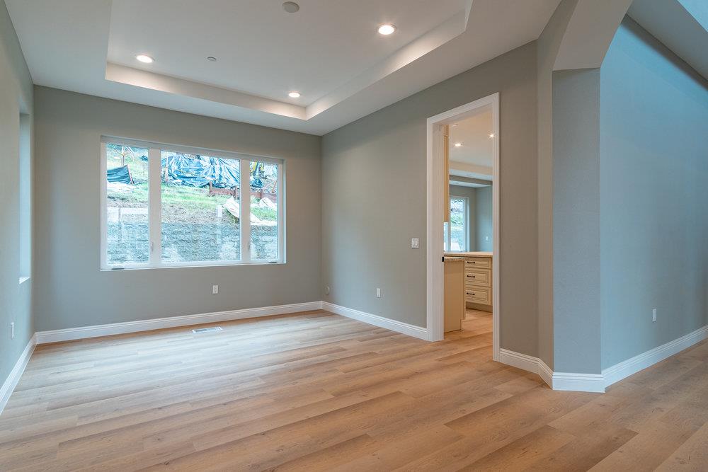 6565 Eagle Ridge Court Gilroy, CA 95020 - Photo 10 of 57 an empty room with wooden floor and windows