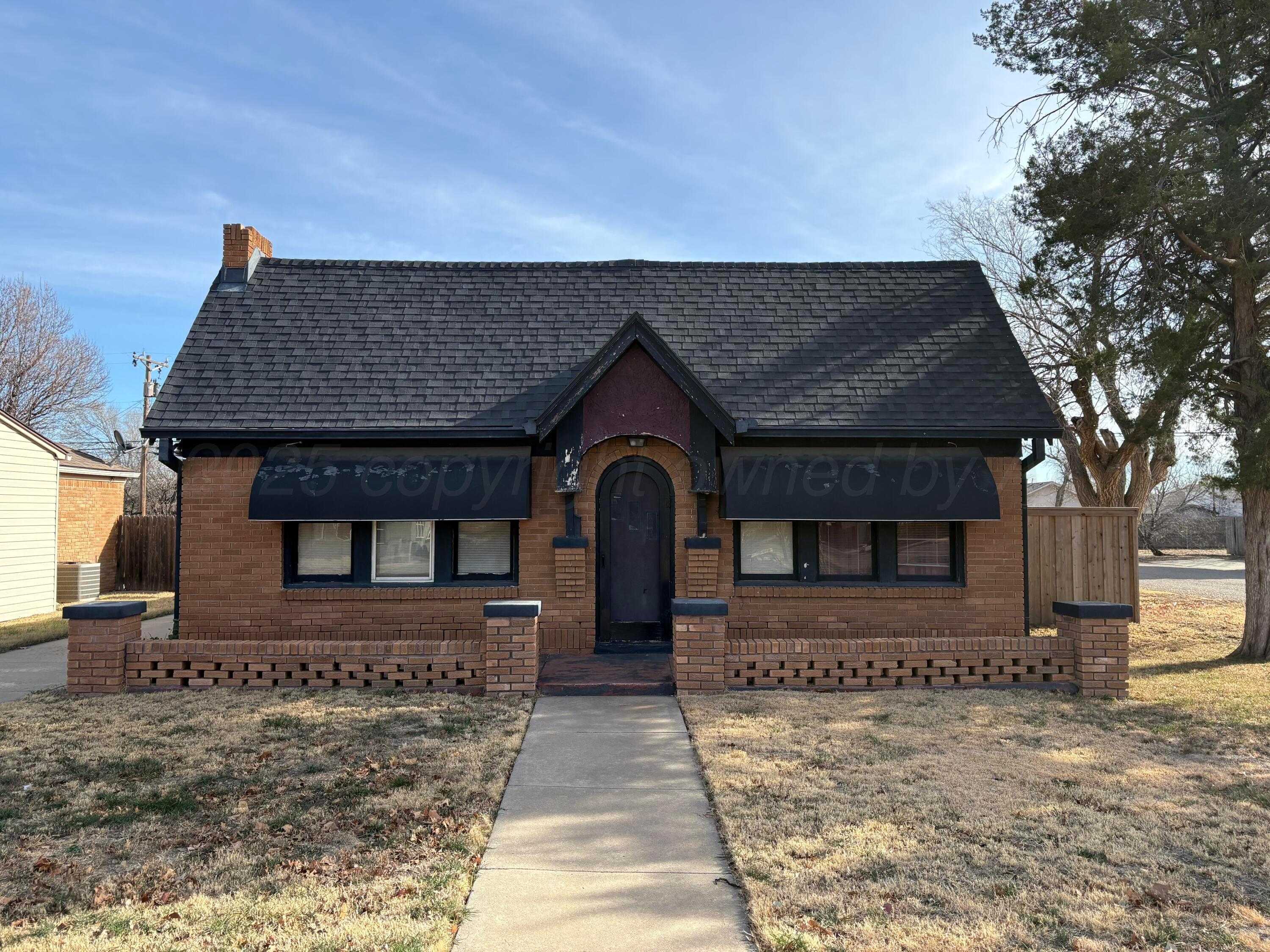 3209 South Harrison Street Amarillo, TX 79109 - Photo 1 of 4 a front view of a house with a yard