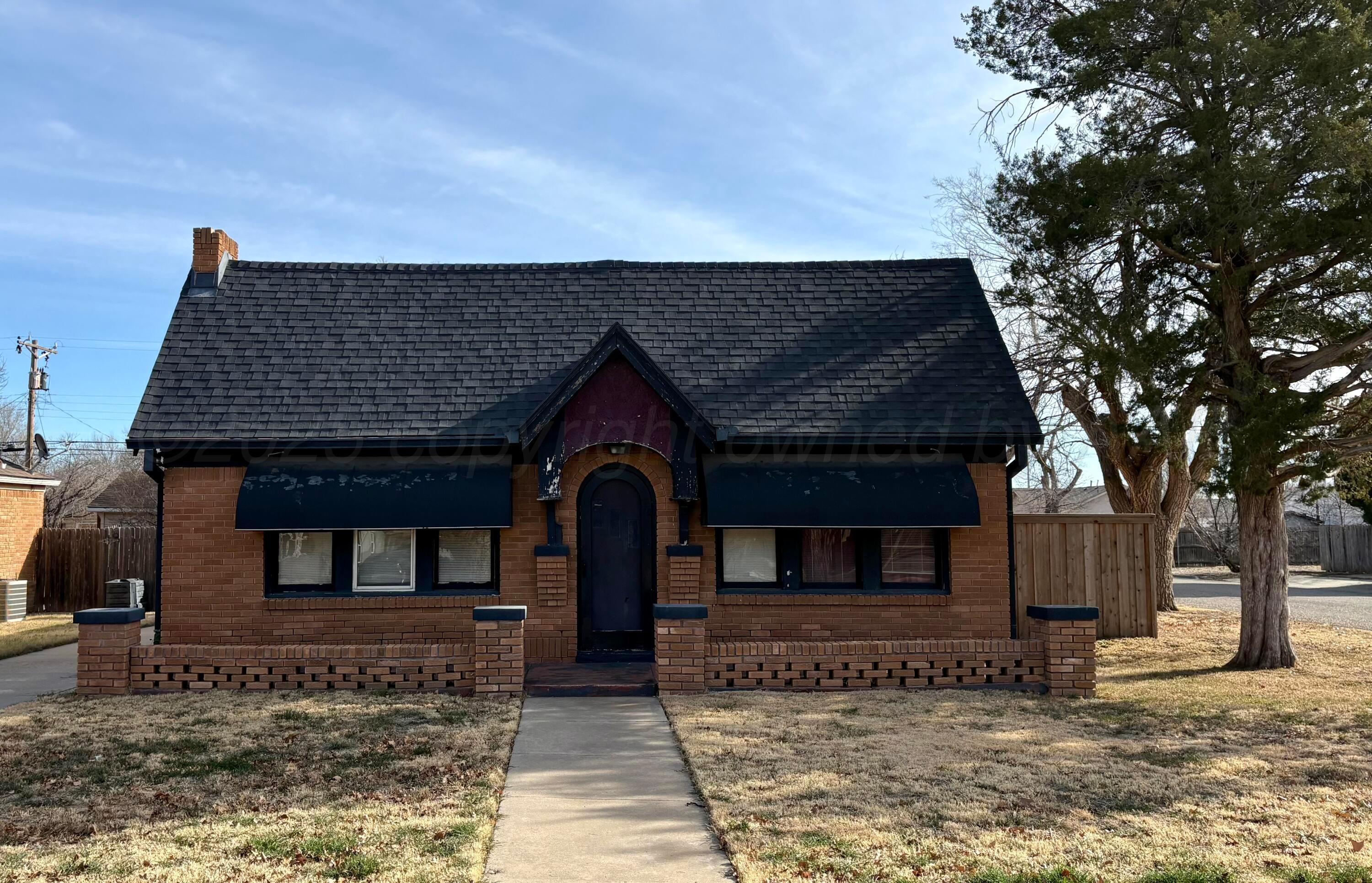 3209 South Harrison Street Amarillo, TX 79109 - Photo 4 of 4 a front view of a house with a yard