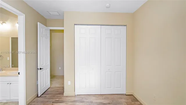 a view of a hallway with closet area