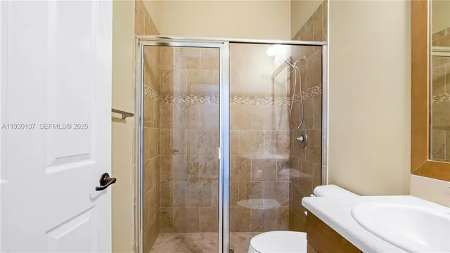 a bathroom with a shower and toilet