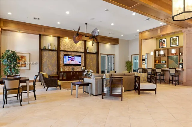 a living room with fireplace furniture and a large window