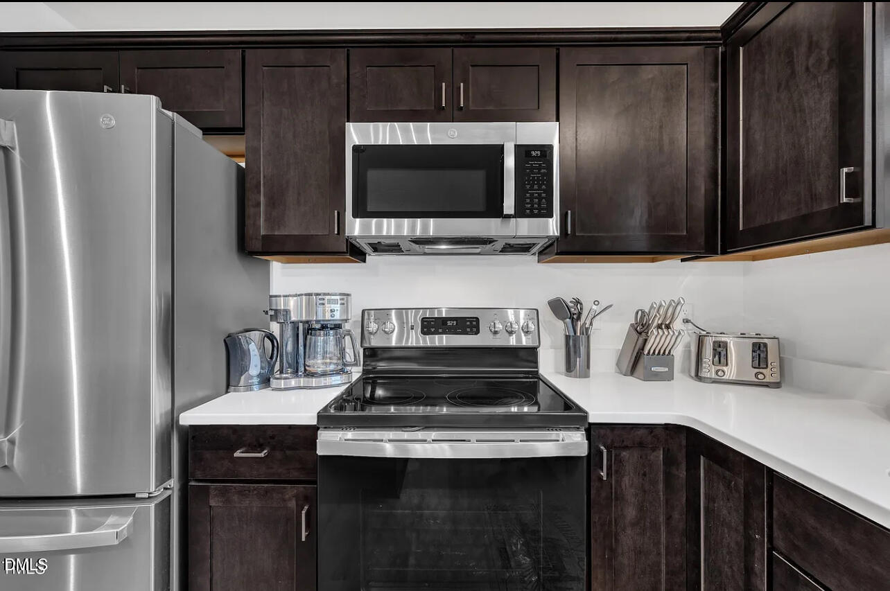 407 Collier Street Smithfield, NC 27577 - Photo 10 of 32 a kitchen with a stove and a microwave