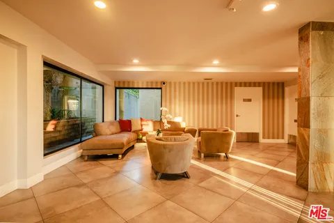 a view of balcony with wooden floor and potted plant