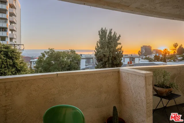 a view of a balcony with an outdoor space