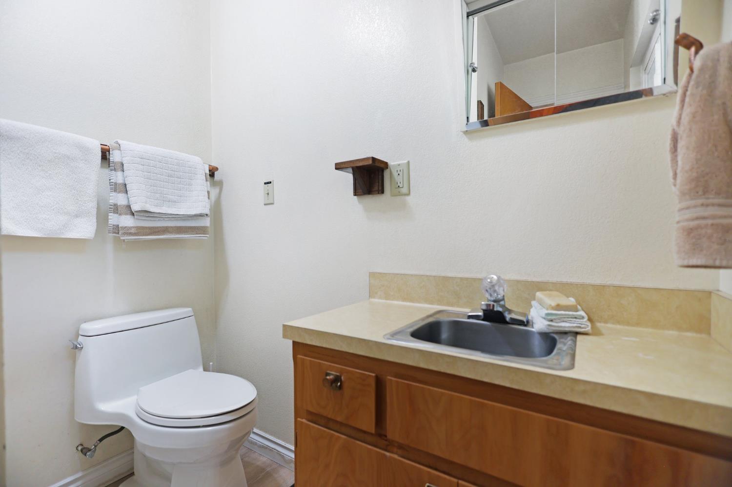 21800 Cedar Ridge Road Manton, CA 96059 - Photo 13 of 35 a bathroom with a sink a toilet and a mirror