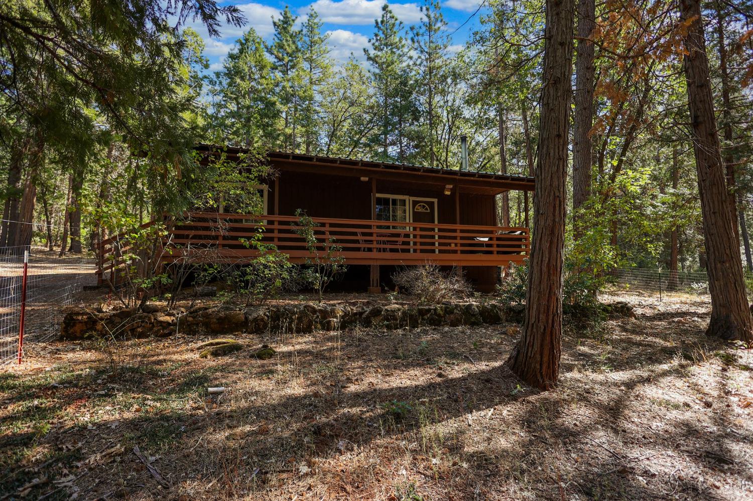 21800 Cedar Ridge Road Manton, CA 96059 - Photo 21 of 35 a backyard of a house with barbeque oven table and chairs
