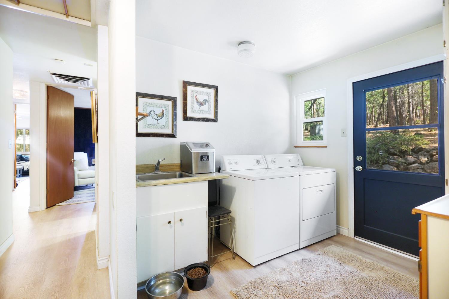 21800 Cedar Ridge Road Manton, CA 96059 - Photo 9 of 35 a utility room with cabinets washer and dryer
