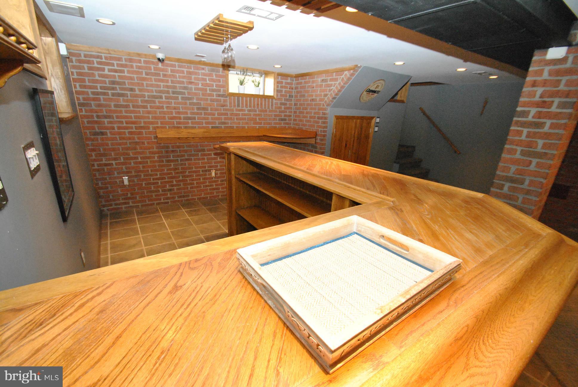 3006 Dunglow Road Baltimore, MD 21222 - Photo 21 of 30 CUSTOM WET BAR AREA W/EXPOSED BRICK WALL