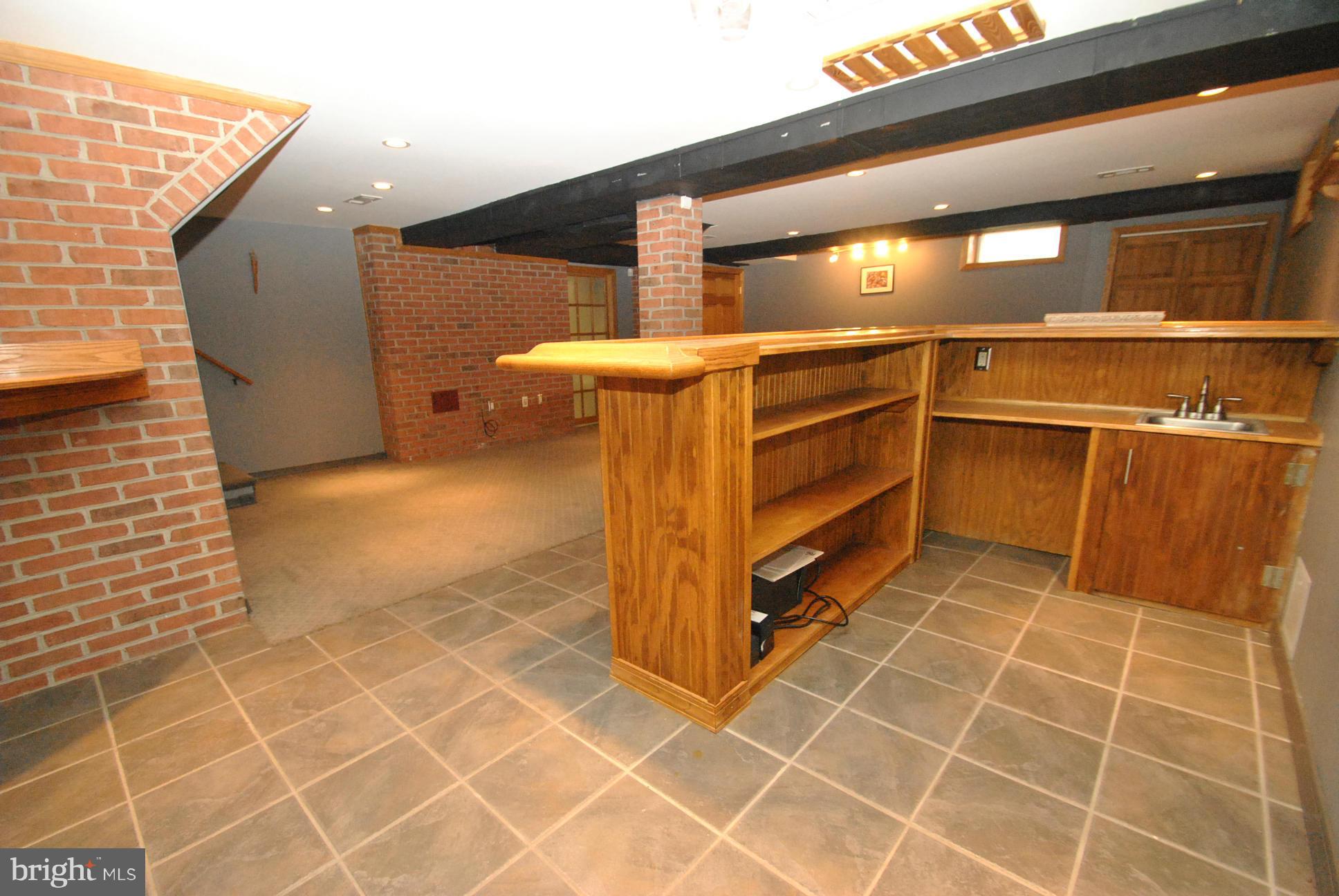 3006 Dunglow Road Baltimore, MD 21222 - Photo 22 of 30 CUSTOM WET BAR AREA W/EXPOSED BRICK WALL
