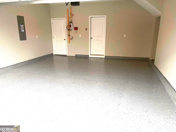 an empty room with an entrance to other room