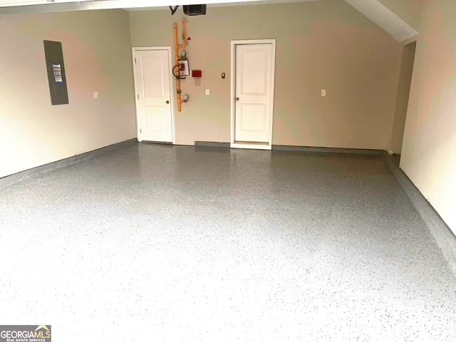 an empty room with an entrance to other room