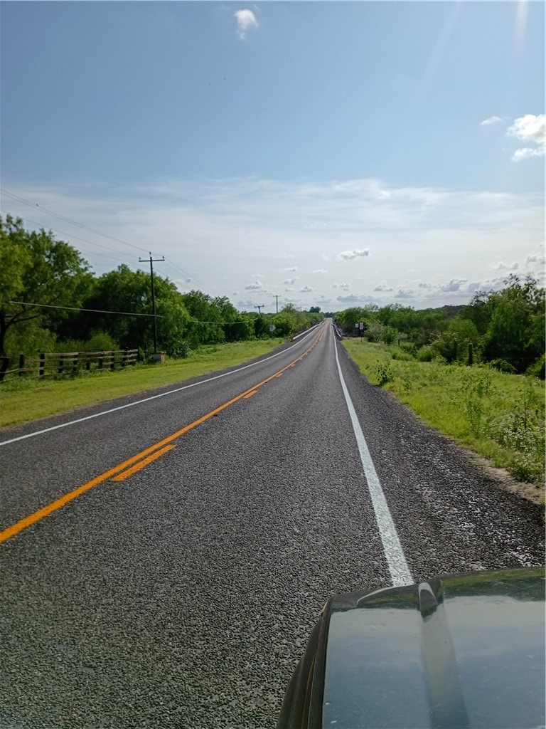108 Swinney Switch Mathis, TX 78368 - Photo 7 of 10 a view of a road with a yard