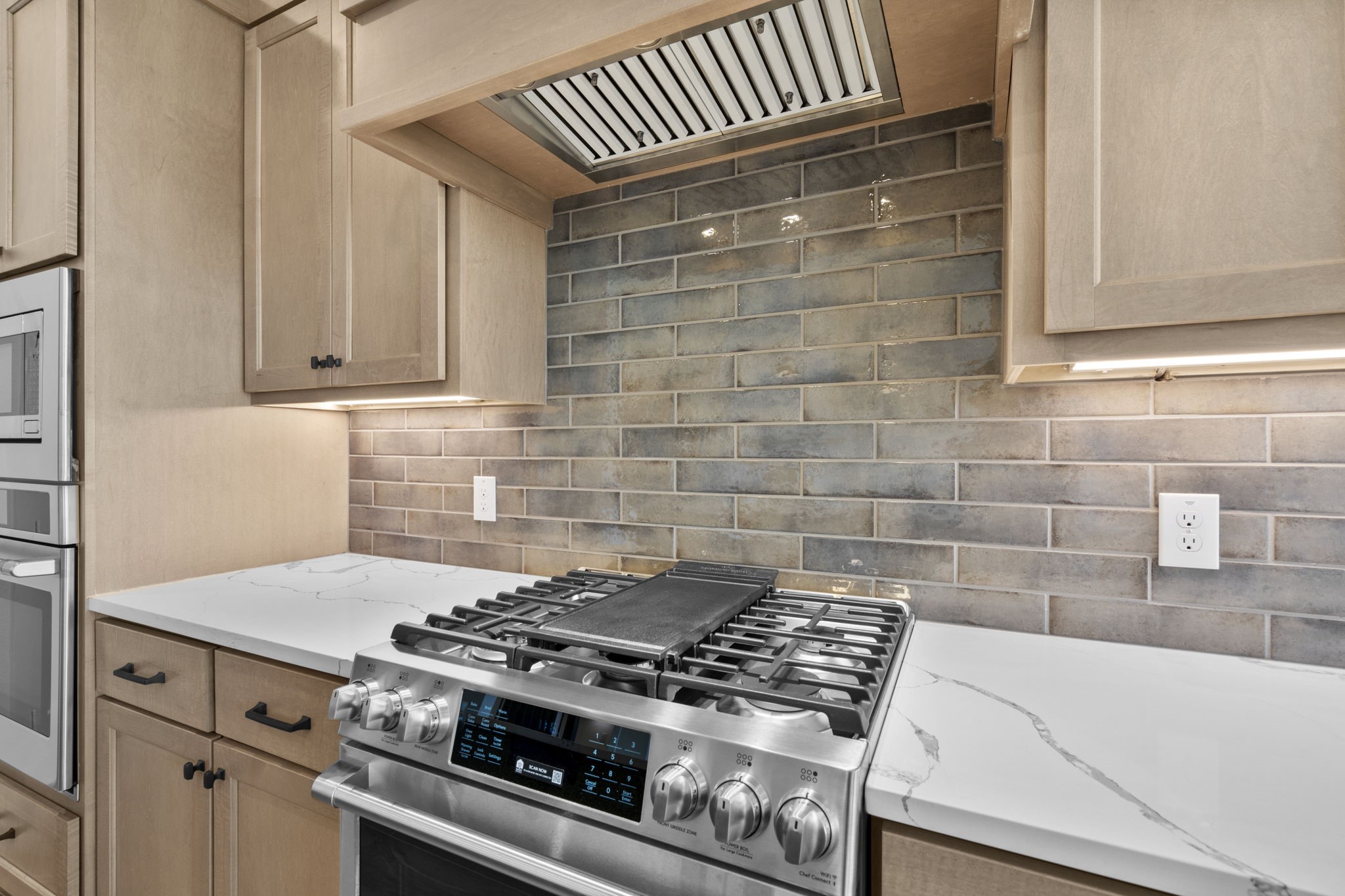 32414 Violet Dancer Court Fulshear, TX 77441 - Photo 19 of 50 a stove top oven sitting inside of a kitchen