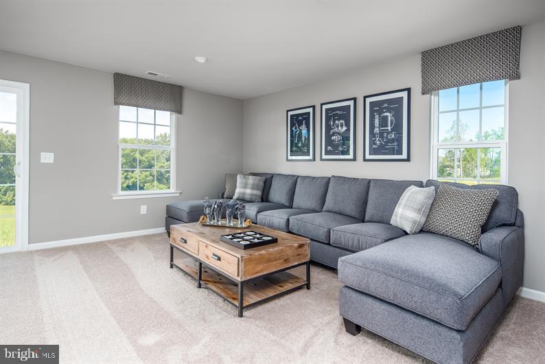 7848 Brandy Station Road, Unit MOZART Hanover, MD 21076 - Photo 17 of 27 a living room with furniture and windows