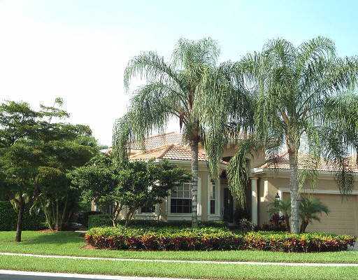 4134 Northwest 60th Street Boca Raton, FL 33496 - Photo 3 of 4 a front view of a house with a yard