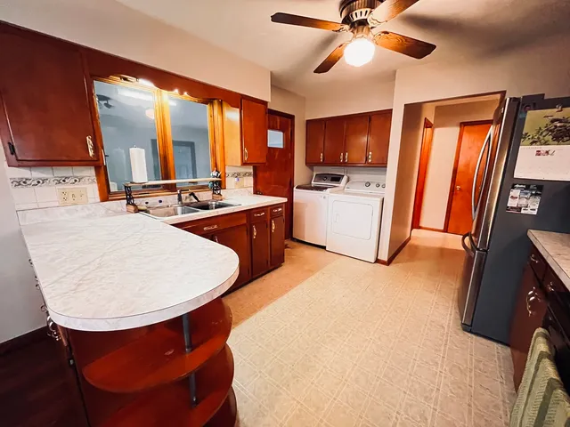 a very nice looking dining room with a large window